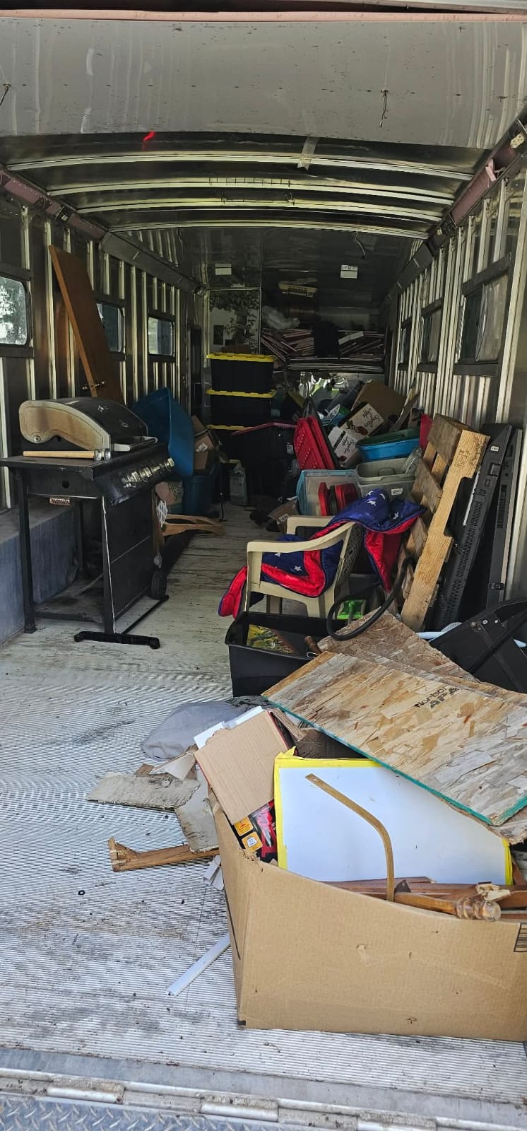 Cluttered garage before junk removal